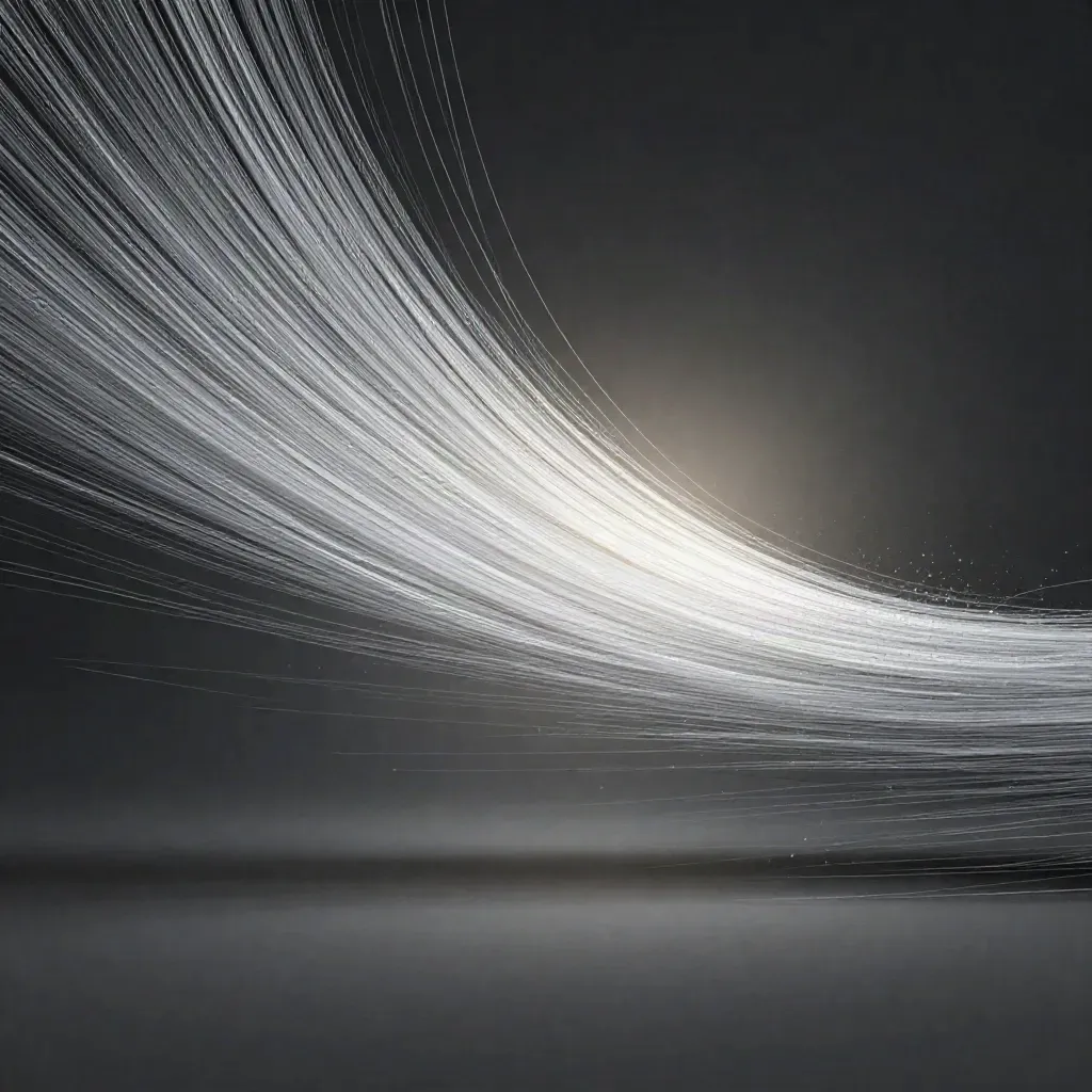 Silver filaments converge into a soft white bloom in deep graphite space.